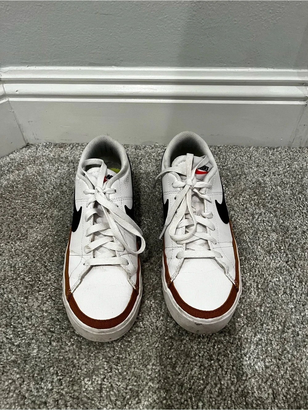 Nike women’s White Sneakers with Black Swoosh and Brown Trim